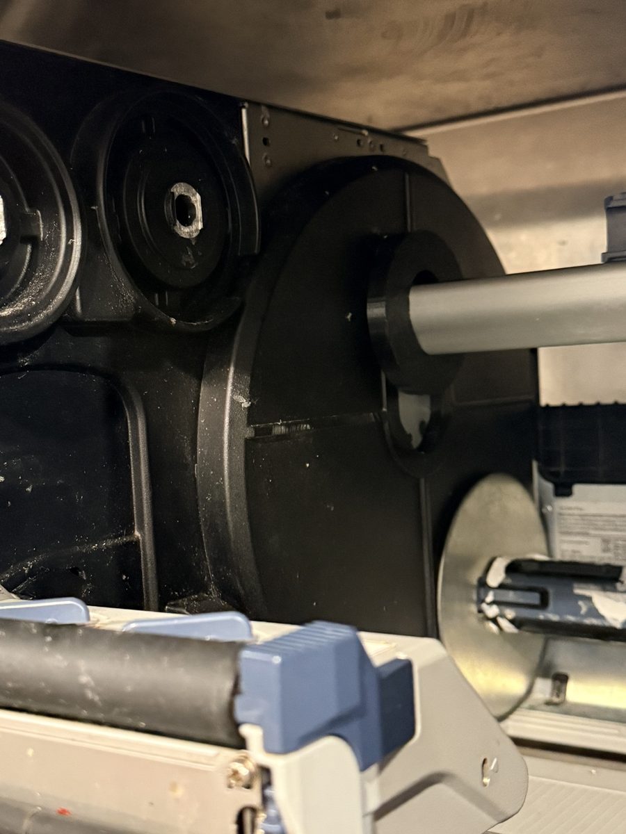Locking collar installed on Sato CL4NX Plus at the plant, view 1
